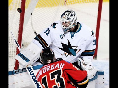 San Jose Sharks Martin Jones makes a save on a shot by Johnny Gaudreau of the Calgary Flames during NHL hockey in Calgary, Alta., on Monday, March 7, 2016. AL CHAREST/POSTMEDIA