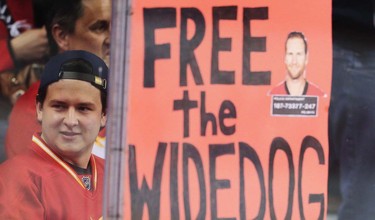 A Flames fan with Dennis Wideman sign before a game against the San Jose Sharks in NHL hockey in Calgary, Alta., on Monday, March 7, 2016. AL CHAREST/POSTMEDIA