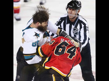 San Jose Sharks Brent Burns fights Garnet Hathaway of the Calgary Flames during NHL hockey in Calgary, Alta., on Monday, March 7, 2016. AL CHAREST/POSTMEDIA
