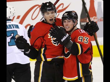 Calgary Flames Joe Colborne celebrates his goal with teammate Sam Bennett after he finally tipped a shot past San Jose Sharks goalie Martin Jones in NHL hockey action at the Scotiabank Saddledome in Calgary, Alta. on Monday March 7, 2016. The Flames lost to the Sharks 2-1 in OT. Mike Drew/Postmedia