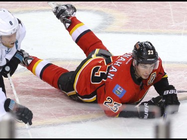 Calgary Flames Sean Monahan falls right off the overtime face-off against the San Jose Sharks in NHL hockey action at the Scotiabank Saddledome in Calgary, Alta. on Monday March 7, 2016. The Flames lost to the Sharks 2-1 in OT. Mike Drew/Postmedia