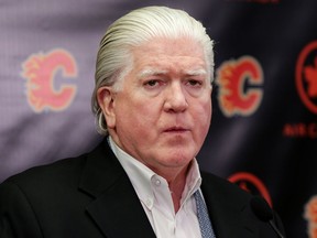 Brian Burke, Calgary Flames president of hockey operations, speaks to members of the media about Dennis Wideman being reinstated during a press conference  at the Scotiabank Saddledome in Calgary, Alta. on Friday March 11, 2016. Leah Hennel/Postmedia