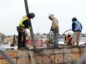 A crew works on a condo complex foundation in Calgary. Shovels turned 
for 167 new apartments downtown in February.