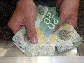 Currently in Alberta, cash stores are allowed to charge $23 for every $100 a customer borrows, to a maximum of $1,500.