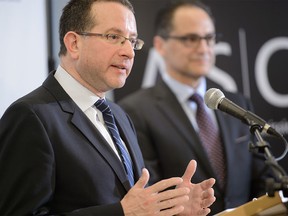 Stan Magidson, left, is appointed as Chair and Cheif Executive Officer of the Alberta Securities Commission (ASC) at the ASC offices in downtown Calgary, AB., on Tuesday, March 29, 2016. Magidson's appointment was announced by Finance Minister Joe Ceci. (Photo by Andy Maxwell Mawji/ Postmedia)