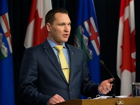Minister of Economic Development and Trade Deron Bilous announces that Terry Boston (not at event) will lead discussions to develop options to phase out emissions from coal-fired power plants by 2030. (Photo by David Bloom.)