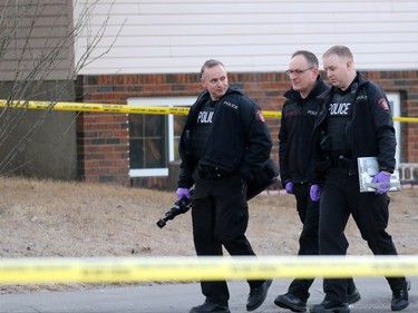 Police investigate a murder scene on the 100 block of Whiteview Road in Whitehorn Tuesday morning. A person was shot in the street at about 3:00 AM.