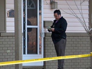 Police door knock at a murder scene on the 100 block of Whiteview Road in Whitehorn Tuesday morning March 1, 2016. A person was shot in the street at about 3:00 AM.