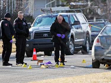 Police investigate a murder scene on the 100 block of Whiteview Road in Whitehorn Tuesday morning. A person was shot in the street at about 3:00 AM.