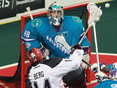 The Calgary Roughnecks' Wesley Berg fires a shot on Rochester Knighthawks goaltender Matt Vinc during National Lacrosse League action at the Scotiabank Saddledome in Calgary on Saturday March 5, 2016.