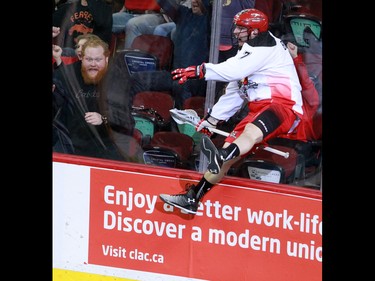 The Calgary Roughnecks' Tyler Burton celebrates scoring on Rochester Knighthawks goaltender Matt Vinc during National Lacrosse League action at the Scotiabank Saddledome in Calgary on Saturday March 5, 2016. Calgary lost 9-8 in overtime.