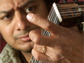 In this 2002 Calgary Herald file photo, Victor Coelho plays his favourite lute.