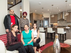 Back row, Sukhbir Singh Bains and Charanjeet Singh Bains. Front row, Sukhbir Kau, Baljinder Kaur
and Simranjeet Kaur Bains. The family bought Pacesetter by Sterling Homes' Santiago 5 model in Redstone.