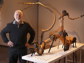 Calgary artist Walter May poses at the Glenbow Museum.