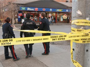 Calgary city police at the scene of a shooting at 12 ave and 11 st SW  in Calgary, Ab., on Thursday, March 3.