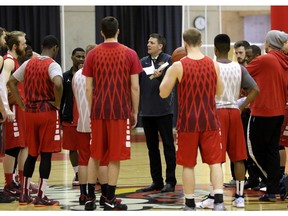 Calgary Dinos men's basketball head coach Dan Vanhooren talks to the the team during practice in Calgary, Ab., on Tuesday March 15, 2016 before they head to the nationals in Vancouver. Leah Hennel/Postmedia