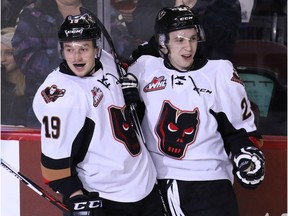 Calgary Hitmen Radel Fazleev congratulates Travis Sanheim after he scored the team's first goal on the Portland Winterhawks' during first period WHL action at the Scotiabank Saddledome on Tuesday February 23, 2016. (Gavin Young/Postmedia) (For Sports section story by Scott Fisher) Trax#