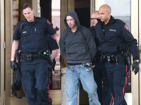 Calgary Police walk a man after arresting him without incident inside the casino on Meridian Rd NE in Calgary, Alta on Thursday March 24, 2016. He was wanted on warrants. Jim WellsPostmedia