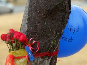 Roses and a balloon memorial in the park on Whiteview Road NE March 2, 2106 mark the spot where Boutrus Osman Khalfan, 25, of Calgary, was killed in a shooting the morning before in Calgary's first homicide of the year.