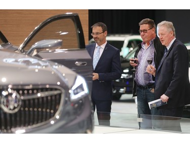 From the left, Dan Broderick, Paul Peters and Glenn Lemmerick admire a Buick Avenir at the Vehicles and Violins Gala Tuesday night March 8, 2016 at the BMO Centre. Sponsored by the Calgary Motor Dealers Association, the gala is in it's 17th year. This year's beneficiaries are Fresh Start Recovery Centre, The Alex and Children's Cottage Society. (Ted Rhodes/Postmedia)