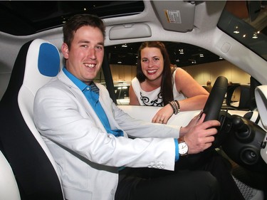 Will Moss and Kat Storwick check out a Smart Car, the Mercedes Benz variety, at the Vehicles and Violins Gala Tuesday night March 8, 2016 at the BMO Centre. Sponsored by the Calgary Motor Dealers Association, the gala is in it's 17th year. This year's beneficiaries are Fresh Start Recovery Centre, The Alex and Children's Cottage Society. (Ted Rhodes/Postmedia)