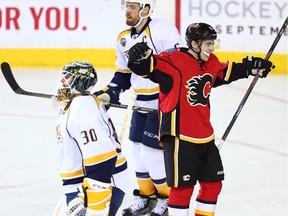 Calgary Flames winger Johnny Gaudreau celebrates  after setting up Mikael Backlund's game-winning overtime goal against the Nashville Predators at the Saddledome on Wednesday.