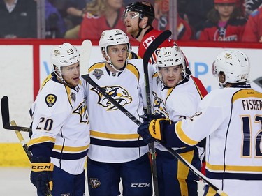 Nashville Predators #2 Anthony Bitetto   celebrates with teammates after scoring against the Calgary Flames during NHL hockey in Calgary, Alta., on Wednesday, March 9, 2016.