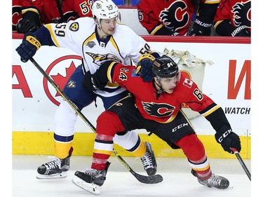 Calgary Flames Garnet Hathaway battles against Roman Josi of the Nashville Predators during NHL hockey in Calgary, Alta., on Wednesday, March 9, 2016.