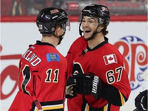 Calgary Flames Michael Frolik celebrates with teammate Mikael Backlund after scoring against the Winnipeg Jets during NHL hockey in Calgary, Alta., on Wednesday, March 16, 2016. AL CHAREST/POSTMEDIA