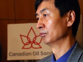 Shareholder Wei Wu attended the final Canadian Oil Sands meeting Monday to vote against what he sees as an undervalued takeover by Suncor Energy. The sale was backed by owners of 99.86 per cent of the stock.