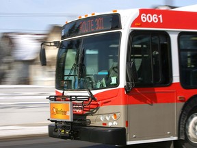 A Calgary Transit bus heads southbound on Centre St near 8 Ave N