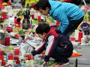 People pay tribute to the 31 victims of the attacks in Brussels last week .