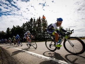 Racers pedal during the Tour of Alberta cycling race near Sylvan Lake, Alta., Thursday, Sept. 4, 2014.THE CANADIAN PRESS/Jeff McIntosh