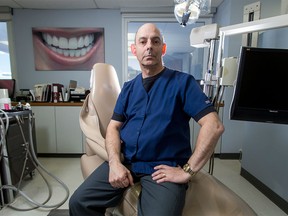 Dr. Larry Stanleigh mugs for a photo at his dental practice in Calgary on Wednesday, March 16, 2016.