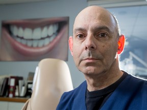 Dr. Larry Stanleigh poses for a photo at his dental practice in Calgary.