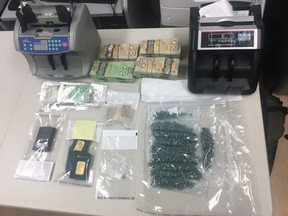 This photo from police shows materials seized in a drug investigation in Kelowna.