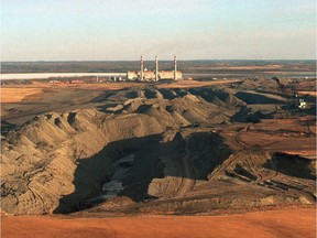 The Highvale coal pit helps feed power plants near Lake Wabamun; TransAlta's Sundance plant is seen at back.