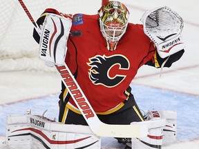 Calgary Flames Joni Ortio with a save against the San Jose Sharks during NHL hockey in Calgary on Monday, March 7, 2016.