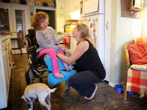 Calgary photojournalist Christina Ryan and her daughter Emily Pitchers,16, who has numerous medical conditions including Down Syndrome, epilepsy and severe developmental delays.