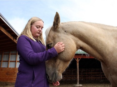 Madison Myatt, 12, found the horses at Whispering Equine helped her deal with stress levels and anxiety. The equine therapists help promote human growth and development.