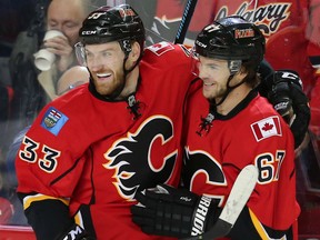 Calgary's Michael Frolik celebrates his first-period goal with teammate Jakub Nakladal in the Flames' 4-1 win over the Winnipeg Jets on Wednesday at the Saddledome.