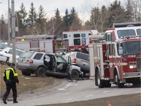 Police and EMS respond to a fatal collision involving multiple cars westbound on Glenmore Trail near the Crowchild overpass in Calgary on Sunday, March 27, 2016.