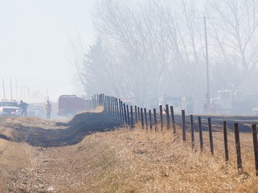 A grass fire southeast of Airdrie near Delacour grew and damaged at least one building and multiple vehicles. Crews had the fire under control by around 4 p.m. on Tuesday, March 29, 2016 in Airdrie, Alta.