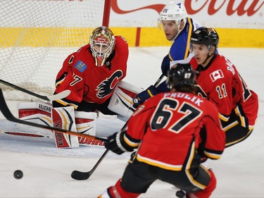 Calgary Flames Joni Ortio makes a save against the St. Louis Blues during NHL hockey in Calgary, Alta., on Monday, March 14, 2016. AL CHAREST/POSTMEDIA