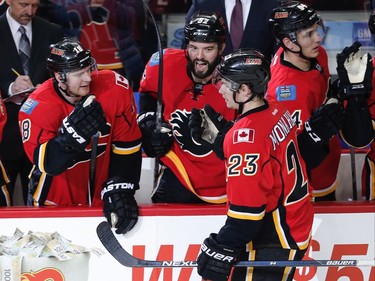 Calgary Flames Sean Monahan celebrates with teammates after scoring against the St. Louis Blues during NHL hockey in Calgary, Alta., on Monday, March 14, 2016. AL CHAREST/POSTMEDIA