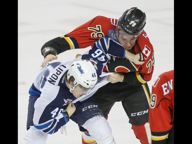 Micheal Ferland of the Calgary Flames fights JC Lipon of the Winnipeg Jets in Calgary, Alta., on Wednesday, March 16, 2016. The Flames won 4-1. Lyle Aspinall/Postmedia Network