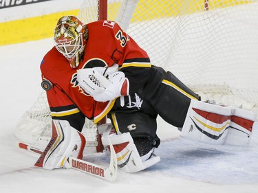 Calgary Flames goalie Joni Ortio stops a Winnipeg Jets shot in Calgary, Alta., on Wednesday, March 16, 2016. The Flames won 4-1. Lyle Aspinall/Postmedia Network