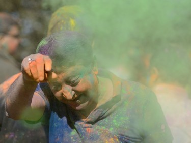 Anuuu Khanna gets doused in colour while celebrating the festival of Holi at Lloyd Park in Calgary, AB., on Saturday, March 26, 2016. Holi, also known as the festival of colours, is a spiritual Hindu festival that marks the arrival of spring.