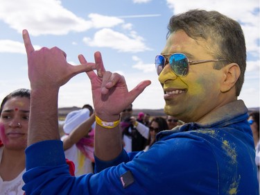 Gaurav Jain dances while celebrating the festival of Holi at Lloyd Park in Calgary, AB., on Saturday, March 26, 2016. Holi, also known as the festival of colours, is a spiritual Hindu festival that marks the arrival of spring.