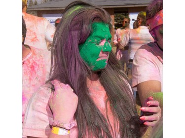 Jagat Kaur reacts to being coloured green while celebrating the festival of Holi at Lloyd Park in Calgary, AB., on Saturday, March 26, 2016. Holi, also known as the festival of colours, is a spiritual Hindu festival that marks the arrival of spring.